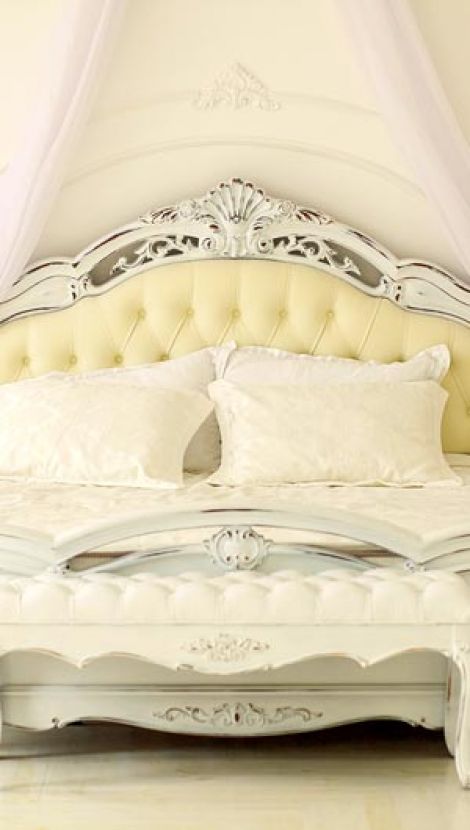 Gold-colored baroque bed